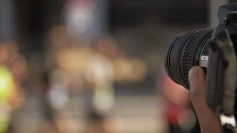 DSLR Camera Close Up taking pictures of an Urban Marathon. Happy runners Stock Footage 104107029