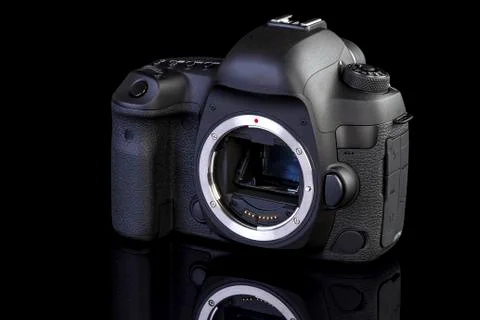 Dslr camera frontal side on black glass Stock Photos