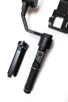 DSLR camera gimbal three-axis motorized stabilizer tripod system Stock Photos