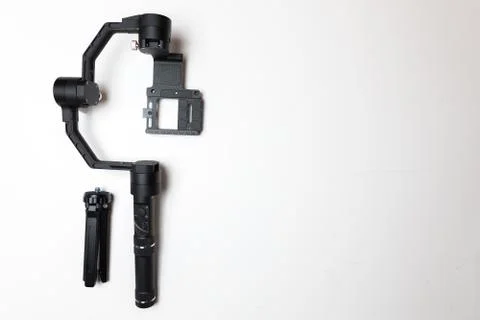 DSLR camera gimbal three-axis motorized stabilizer tripod system Stock Photos