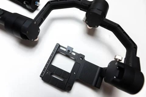 DSLR camera gimbal three-axis motorized stabilizer tripod system Stock Photos