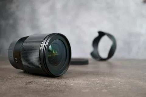 Dslr camera lense, close-up view on table with smooth background Stock Photos