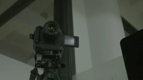 DSLR Camera Mounted on Tripod in Studio Setup Stock Footage 343880108