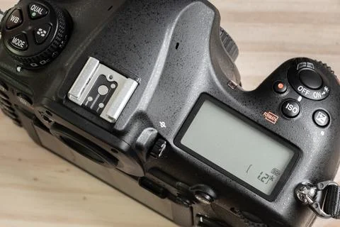 DSLR camera overhead view, second LCD display on the top, switched off state. Stock Photos