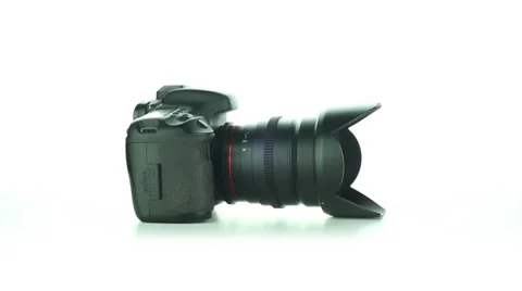 DSLR camera rotates on a white background Stock Footage 37240790