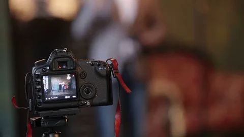 DSLR camera shooting video Stock Footage 72753854