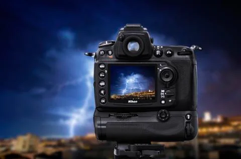 DSLR camera under a lightning storm Stock Photos