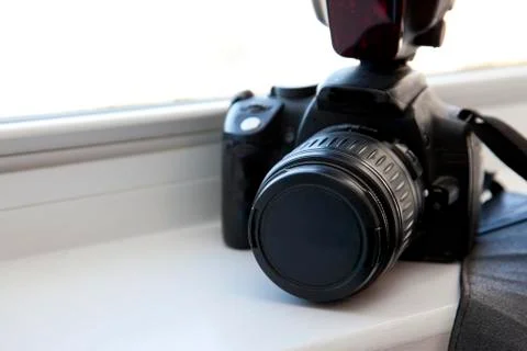 DSLR camera in the window Stock Photos
