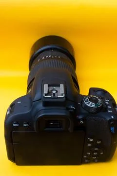 Dslr camera on yellow background Stock Photos