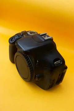 Dslr camera on yellow background Stock Photos