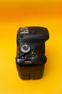 Dslr camera on yellow background Stock Photos