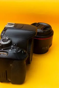 Dslr camera on yellow background Stock Photos