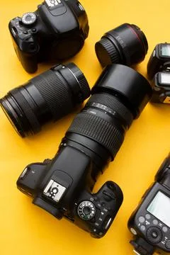 Dslr camera on yellow background Stock Photos