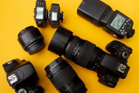 Dslr camera on yellow background Stock Photos