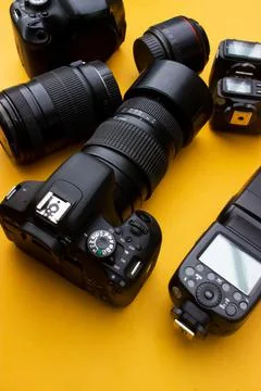 Dslr camera on yellow background Stock Photos
