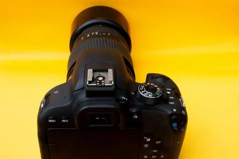 Dslr camera on yellow background Stock Photos