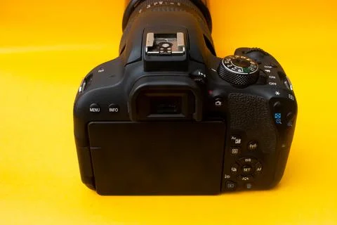 Dslr camera on yellow background Stock Photos