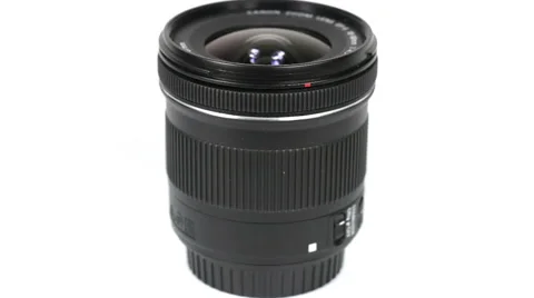 DSLR lens rotating on white background Stock Footage 40387329