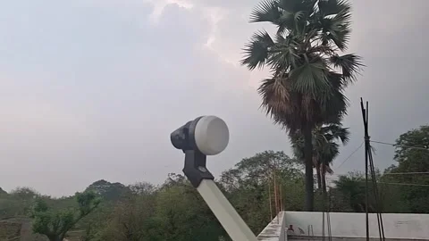 A DTH receiver and dish receive satellite signals, decoding digital TV Stock-Footage 306594292