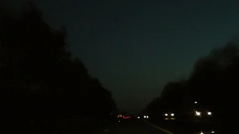 Dual Carriageway at Dusk through trees 動画素材 104311461