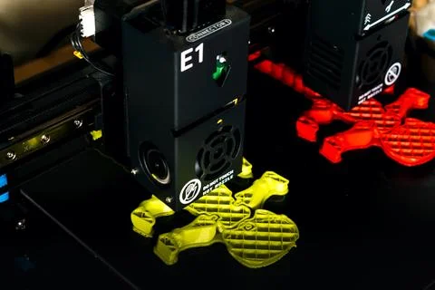 Dual extruder 3d printer which is printing two bicolor model, idex technology Stock Photos
