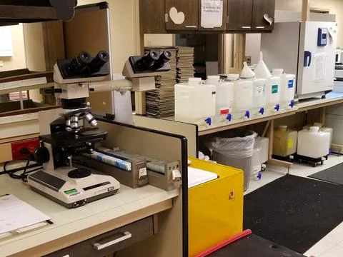 Dual Headed Microscope in Pathology Laboratory w Slide Cabinets Stock Photos