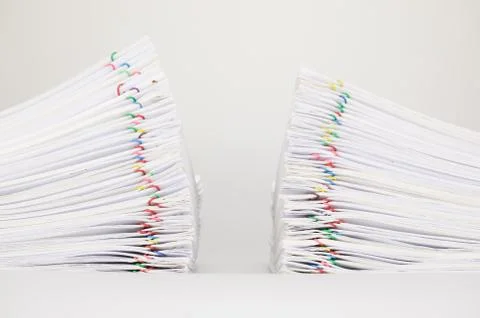 Dual pile overload document of report on white background Stock Photos