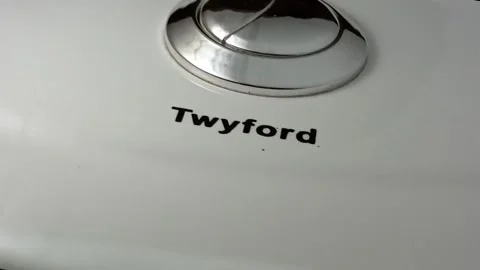 Dual silver push button on white Twyford water closet. Stock Footage 313772386