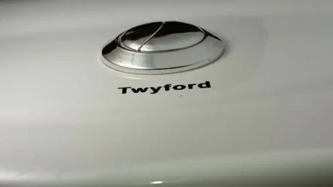 Dual silver push button on white Twyford water closet. Stock Footage 315544769