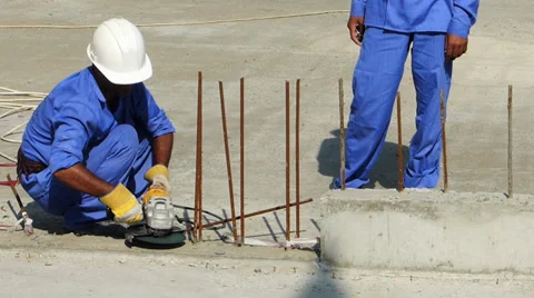 Dubai construction site foreign migrant workers working hot sun UAE Stock Footage 36198978