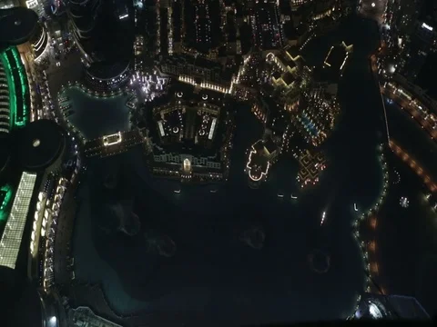 The Dubai Fountain next to Burj Khalifa. Stock Footage