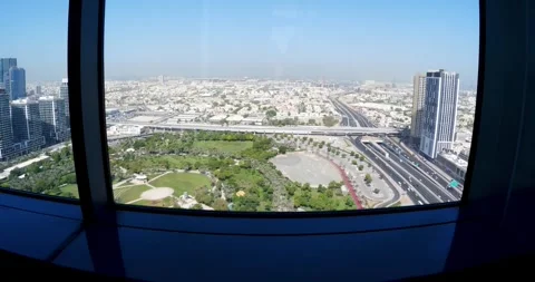 Dubai frame glass elevator elevated panoramic perspective showcases a sprawli Stock Footage 296843474