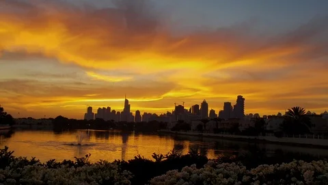 Dubai high rise building at the back of the lake during sunset- Stock Footage 101447922