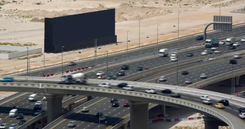 Dubai highway interchange with traffic, aerial view of roads and desert Video stock 340432002