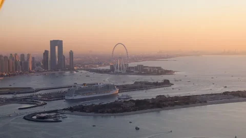 Dubai JBR Beach and Bluewaters island at sunset with Ain Dubai Stock Footage 327978902