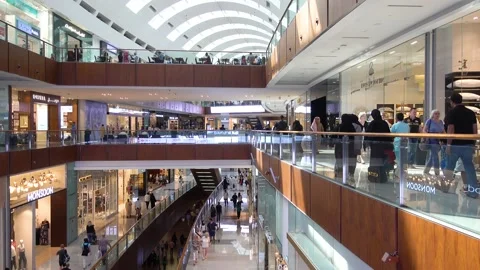 Dubai Mall, interior inside, shoppers walk around the store. 動画素材 145497810