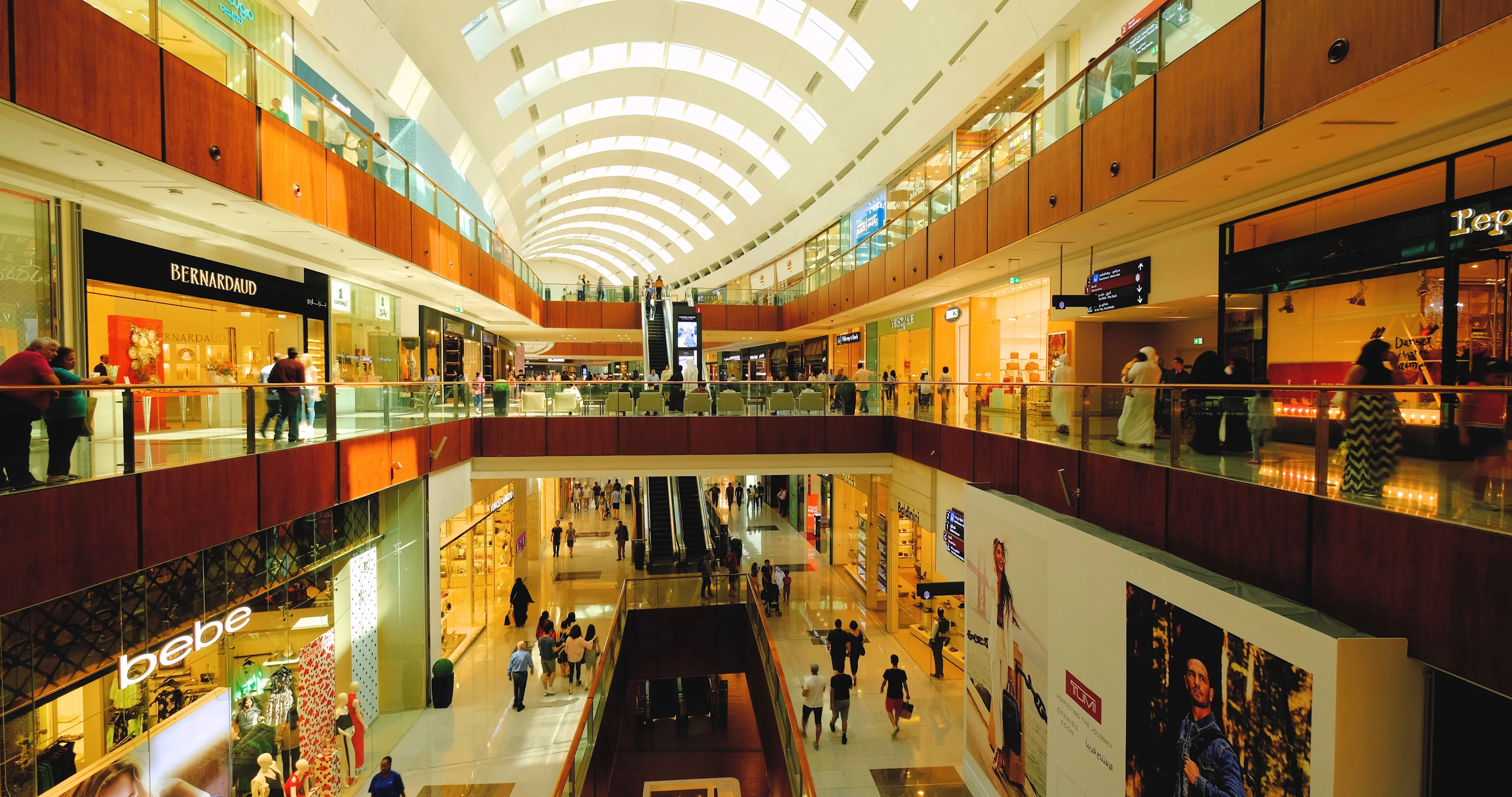 Dubai Mall Shopping Spree. Tourists People Walking Enjoying Shopping in the big