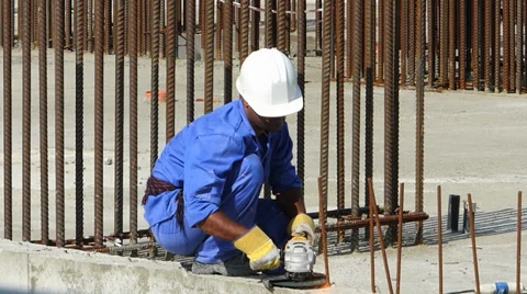 Dubai Marina construction site foreign migrant workers working in hot sun UAE Stock Footage 36684404