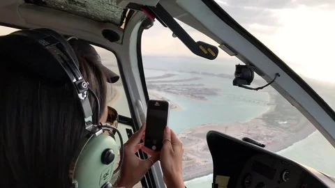 Dubai Palm Jumeirah from helicopter. The city attracts 20 Stock Footage