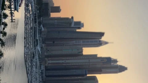 Dubai panoramic view of marina and modern buildings, sunset time, vertical video Stock Footage 231584440