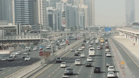 Dubai Sheikh Zayed Road E11 traffic movement and metro train 動画素材 119087174
