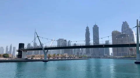 Dubai Skyline Architecture And Bridge From Dubai Water Canal Stock Footage