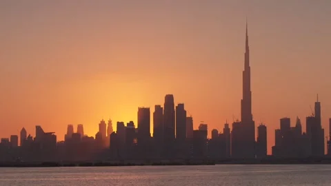 Dubai Skyline with sun behind it - 1 Stock Footage 144754408