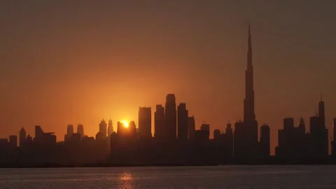 Dubai Skyline with sun behind it - 2 Stock Footage 144754574