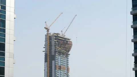 Dubai skyscraper under construction, cranes on tall apartment building Vídeo Stock 155985255
