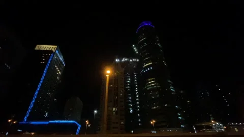 Dubai skyscrapers  at night while driving car on the Highway. Stock Footage 145961564