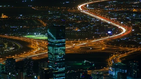 Dubai traffic skyline panorama night time-lapse UAE. zoom out Stock Footage 124024088