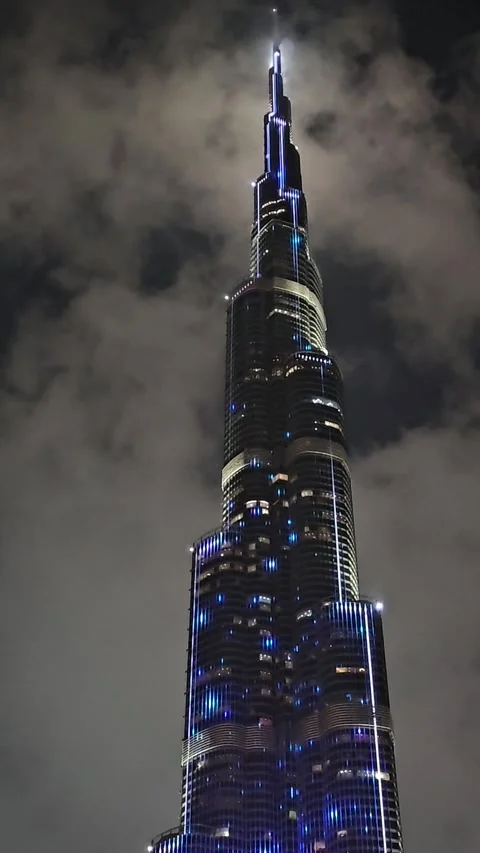Dubai Uae - 03 29 2024 : Burj Khalifa Piercing Through The Night Clouds Stock Footage 271354242