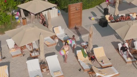 Dubai, UAE - 1 14 2023: A drone flies over the beach of a luxury hotel. Young Stock Footage 243157630