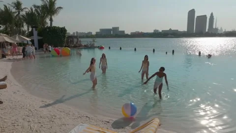 Dubai, UAE - 1 14 2023: A drone flies over a sandy beach with vacationing people Stock Footage 243157788